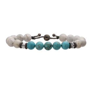 Detail of adjustable white turquoise and blue stone beaded bracelet with metal spacers