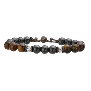 Detailed macro view of tiger eye beads with adjustable bronze metal drawstring clasp