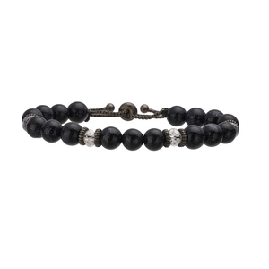 Detail of blue goldstone beads and adjustable braided cord on a beaded bracelet