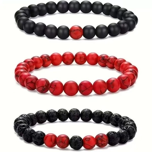 Three-piece beaded bracelet set with matte black, red marble, and volcanic lava stones