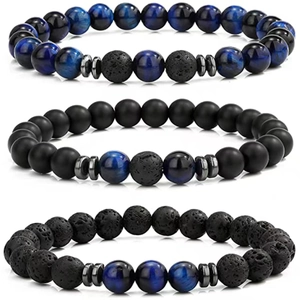Macro detail of natural tiger eye and lava stone beaded bracelets set for men