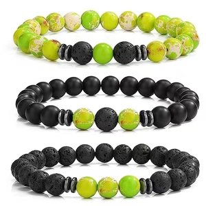 Detailed macro view of 3-piece beaded bracelet set with tiger eye and volcanic stone