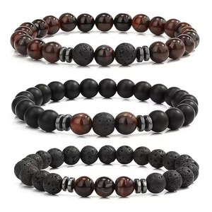 Detailed view of beaded bracelet set with tiger eye, lava rock and matte agate stones