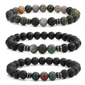 Detailed close-up of 8mm beaded bracelets set with lava rock, hematite, and tiger eye