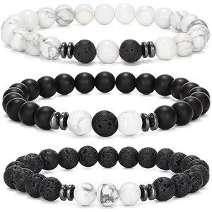 Three-piece beaded bracelet set featuring white turquoise, black lava rock and matte beads