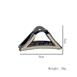 Eleganter geometrischer Dreieck-Haarclip mit Strasssteinen in Schwarz und Gold-Optik