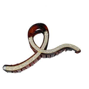 Elegant tortoise shell hair claw clip with rhinestones and geometric resin design