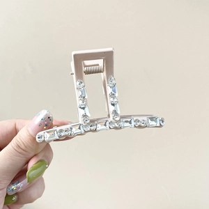 Elegant cream hair claw clip with sparkling rhinestones for stylish women hairstyles