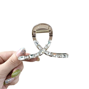 Elegant crystal claw clip in brown acrylic with geometric rhinestones and gold spring