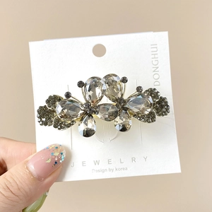 Barrette à cheveux élégante avec double papillon en strass gris et cristaux clairs