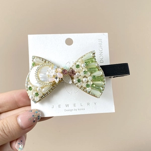 Luxurious handmade hair clip with green rhinestones, pearls and flower ornaments