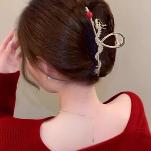 Golden dragon hair claw clip with rhinestones and red bead for New Year festive styling