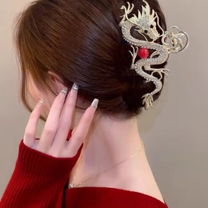 Golden dragon hair claw clip with rhinestones and red bead for traditional Chinese hairstyles