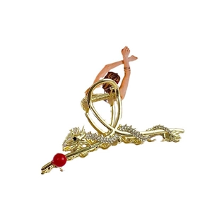 Golden dragon-shaped hair claw clip with red beads and white crystals for women