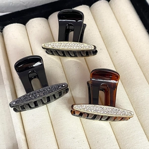 Elegant rhinestone hair claw clips in black and tortoiseshell finish for women