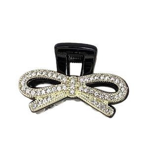 Eleganter schwarzer Haarklammer mit glitzernder Strass-Schleife auf Goldbasis