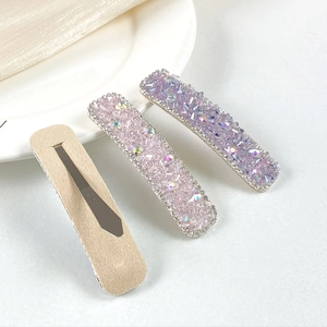 Three-piece set of luxury crystal hair clips with pink and purple rhinestones on silk