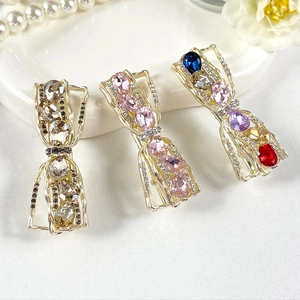Three elegant crystal hair clips set with champagne gold base and colorful rhinestones