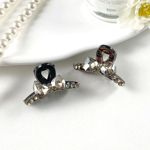 Petites pinces à cheveux élégantes avec nœud en strass pour femmes en noir et ambre