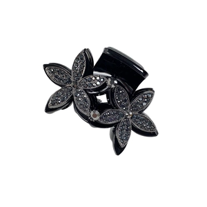 Elegant black resin hair claw clip with double rhinestone flower design on white background