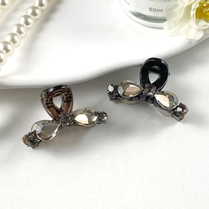 Mini pinces à cheveux élégantes avec strass champagne en finitions marron foncé et noir brillant