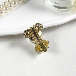 Pince à cheveux bec de canard dorée élégante avec perles grises et détails en cristal