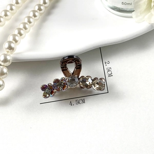 Elegant pearl rhinestone hair claw clip with floral design in translucent dark brown
