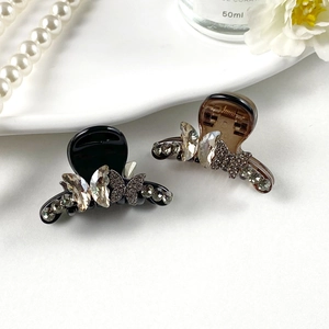 Exquisite butterfly hair clips with sparkling rhinestones in black and amber brown