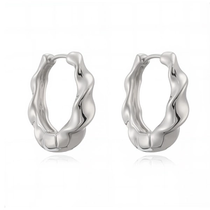 Minimalist silver wavy hoop earrings with high-polished metallic mirror finish