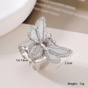 Macro shot of gold-plated bee ring showing 2.3cm wing width and zircon inlay details