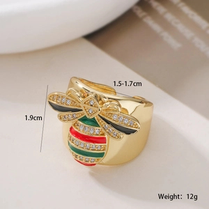 Detailed macro view of 18K gold-plated bee ring with red enamel and white zircon stones