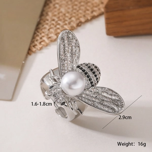 Macro detail of 18K gold plated bee ring showing dimensions and zircon wings
