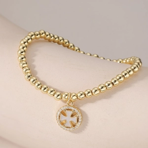 Bracelet perlé minimaliste plaqué or 18 carats avec pendentif croix et zircon