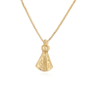 Macro detail of 18K gold plated crown pendant on a sleek box chain necklace