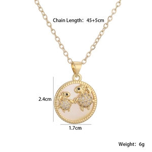 Detailed specs of gold turtle necklace with white shell pendant and zircon inlay