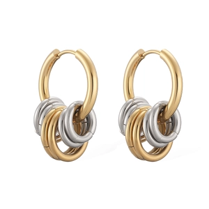 Detailed macro view of two-tone gold and silver interlocking polished hoop earrings