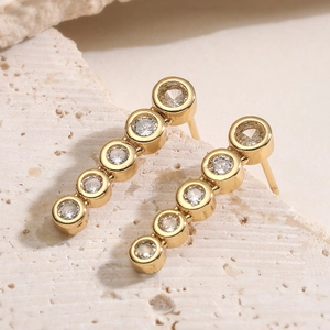Minimalist 18K gold plated drop earrings featuring five vertical sparkling zircons