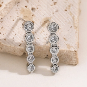 Minimalist long geometric silver drop earrings featuring five zircons in bezel settings