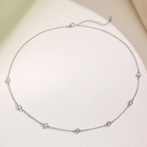 Elegant 18K gold plated necklace with seven bezel-set zircons on a delicate chain