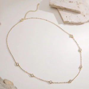 Elegant 18K gold plated copper necklace featuring seven sparkling zircon stones for women