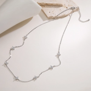 Detail of silver clover necklace with lobster clasp and adjustable extension chain link