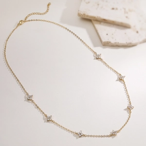Elegant 18K gold plated necklace featuring eight sparkling zircon flower pendants