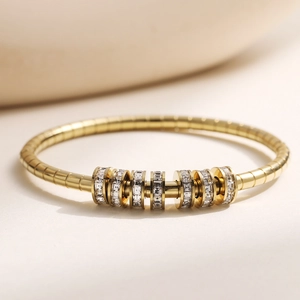18K gold-plated stainless steel flexible bangle with seven sliding zircon-set beads