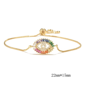 Bracelet œil porte-bonheur avec zircons colorés et chaîne coulissante dorée réglable
