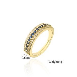 Detail view of 18K gold ring with three rows of zircons and blue gemstones, 0.6cm wide