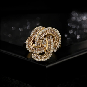 Luxurious gold-plated copper cocktail ring with geometric cross design and pavé zircon stones