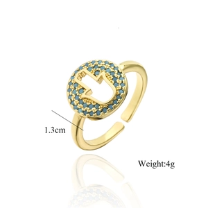 Detail view of adjustable gold ring featuring Hamsa hand design with blue beads and 1.3cm size
