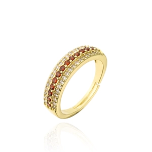 Detailed close-up of 18K gold ring with three rows of red and white cubic zirconia