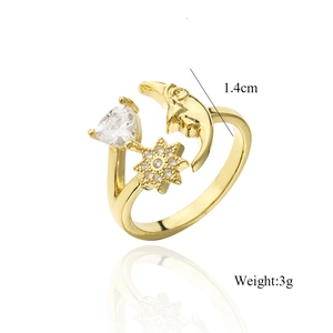 Detailed view of gold sun and moon open ring with zirconia stones and 1.4cm size label