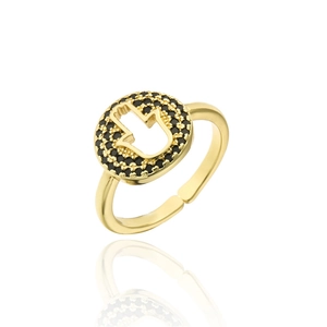 Macro shot of gold Hamsa hand ring featuring micro-pave black zircons on open band
